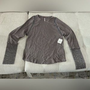 New, with tags, Free People long sleeve shirt with rhinestone sleeves.